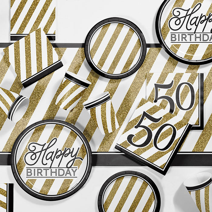Black and Gold 50th Birthday Party Supplies on a table