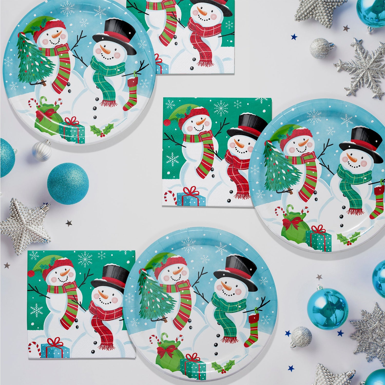 Frosty Friends plates and napkins featuring 2 snowmen, Christmas gifts and snowflakes
