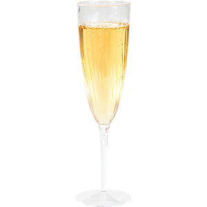 Plastic champagne glass with champagne in it
