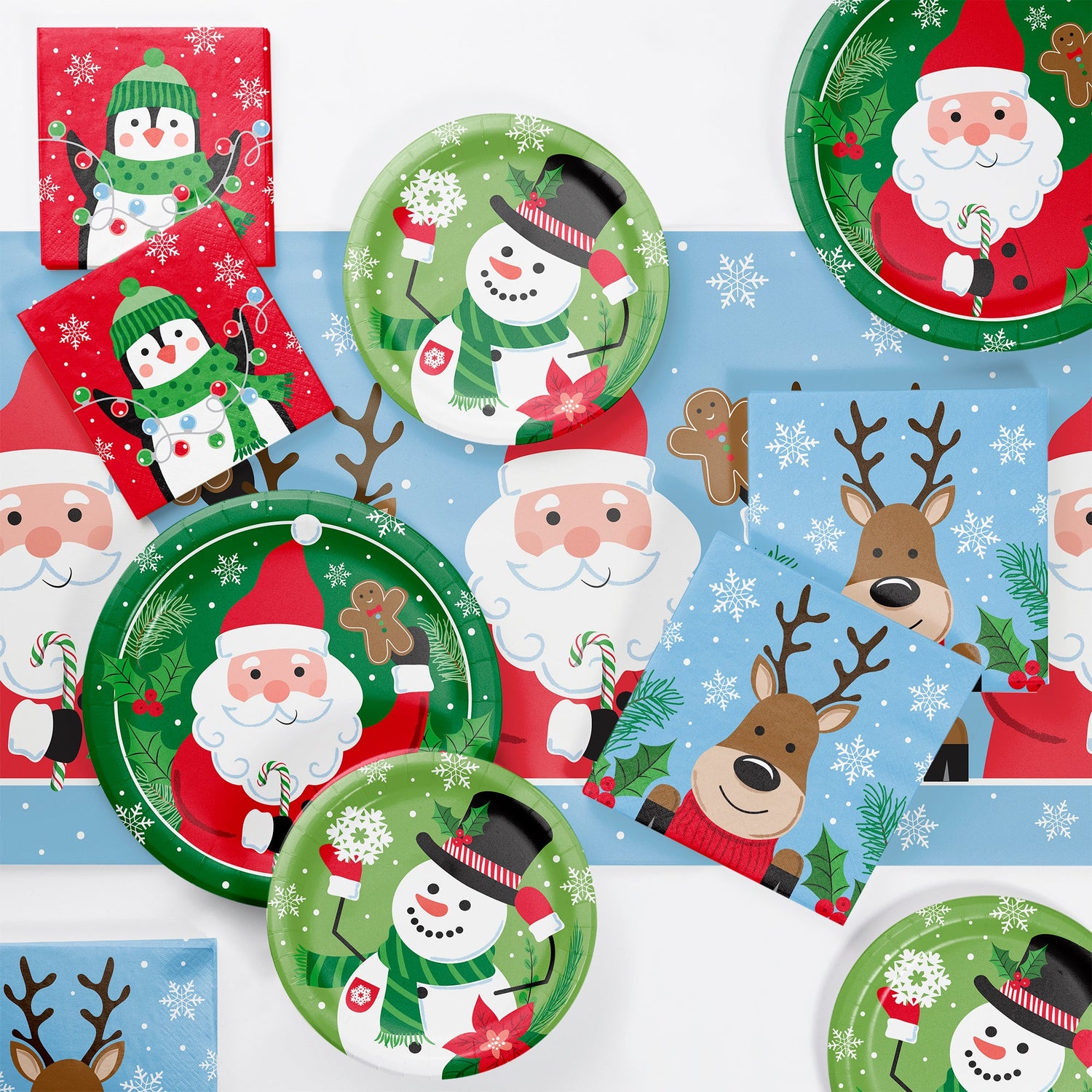 Set of Christmas-themed paper plates with Santa Claus, reindeer, and snowmen on a white background.