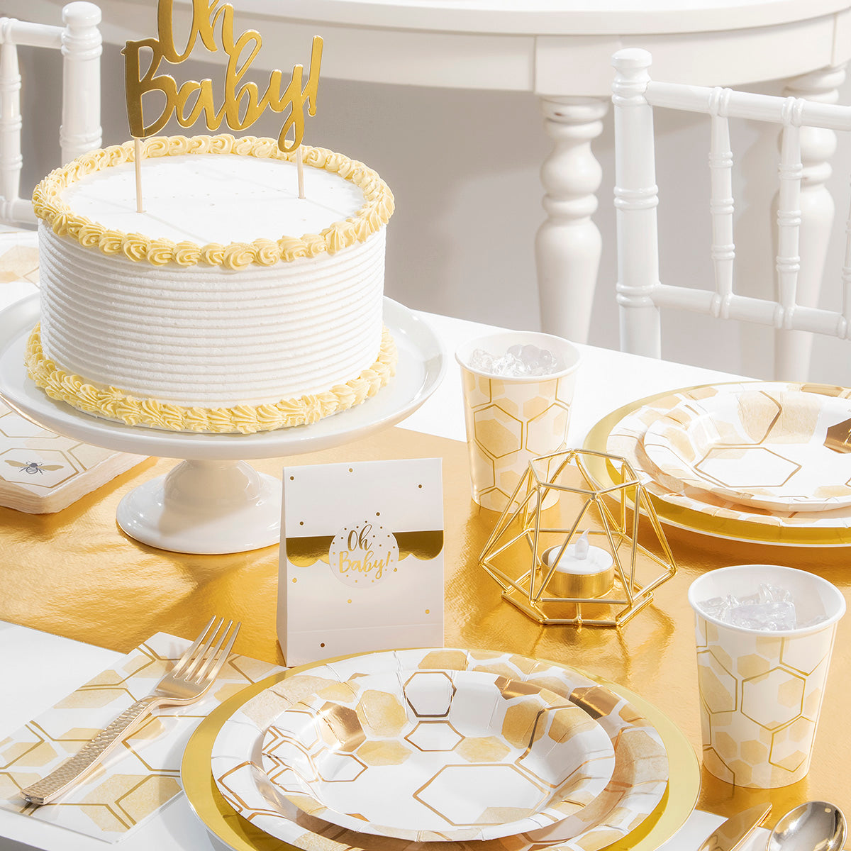 Honeycomb Baby Shower Supplies on a table