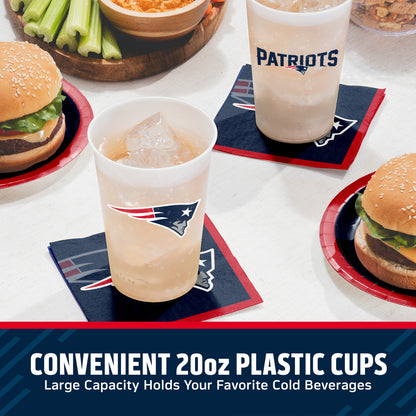 Two 20oz plastic cups with New England Patriots logos, shown on navy and red coasters at a table with burgers, celery, and bowls. Text at the bottom reads 'CONVENIENT 20oz PLASTIC CUPS Large Capacity Holds Your Favorite Cold Beverages'.