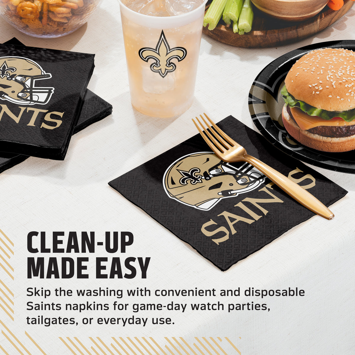 Black paper napkins with the New Orleans Saints helmet logo and gold 'SAINTS' text, shown on a tabletop with a burger, drink, fork, and promotional text about easy cleanup.