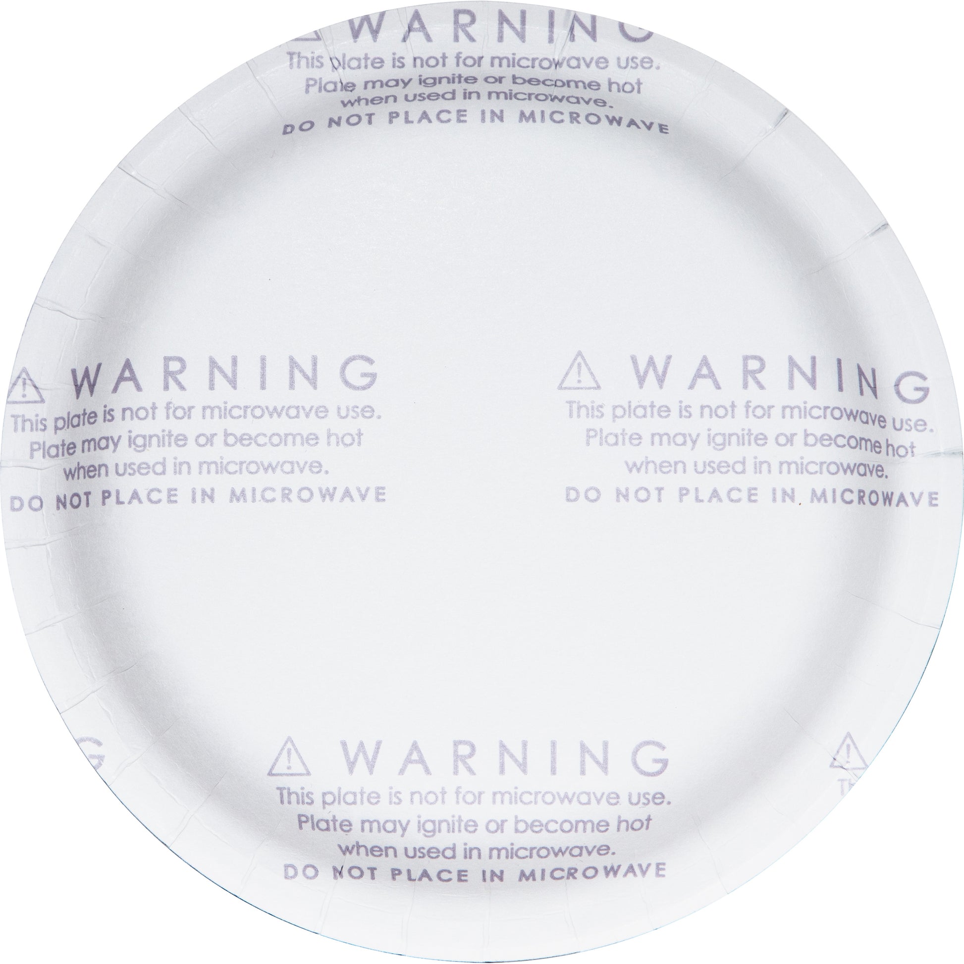 Dinner plate with warning label on the back saying "This plate is not for microwave use"