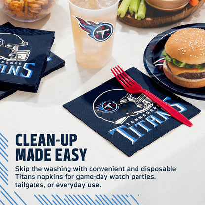 Titans-branded disposable napkins and a matching drink cup on a tabletop with food props, plus promotional text reading 'CLEAN-UP MADE EASY.' This is a styled product scene rather than a person-centered lifestyle shot, so Product/Packaging fits best.