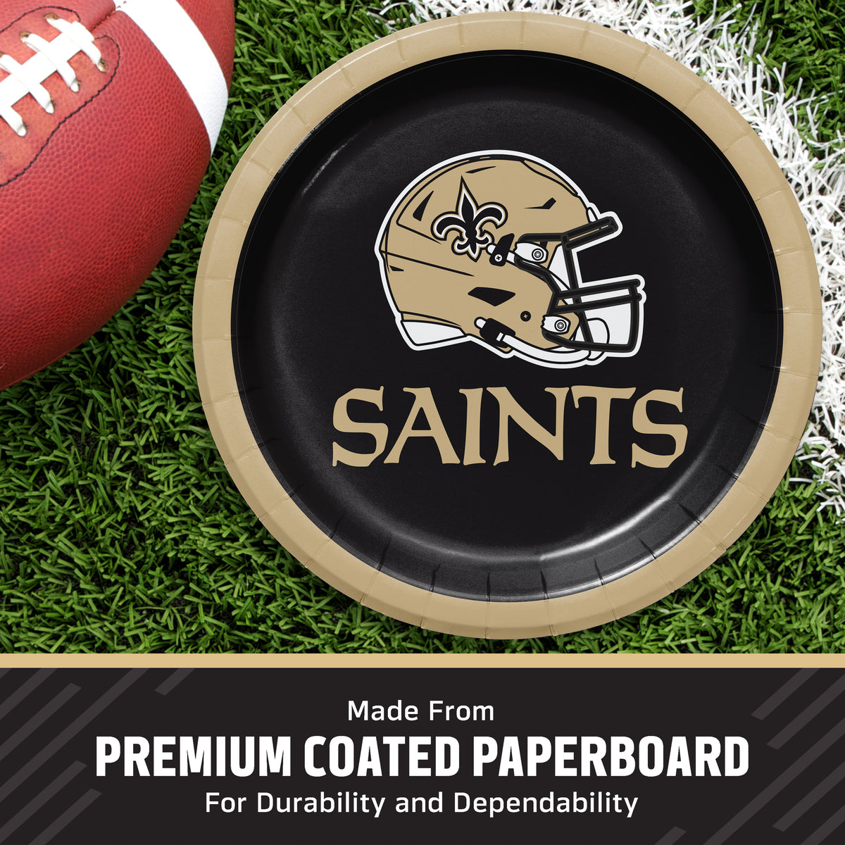 A round black paper plate with a gold rim, printed with the New Orleans Saints helmet logo and the word 'SAINTS' in gold, shown on a grassy field with a football partially visible. Text at the bottom reads 'Made From PREMIUM COATED PAPERBOARD For Durability and Dependability'.