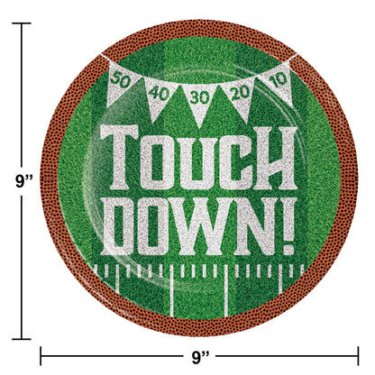 Tailgate Time Touch Down Dinner Paper Plates 96 ct. Football paper plate with "Touch Down!" written on it on a grass background with brown rim. Dimensions included