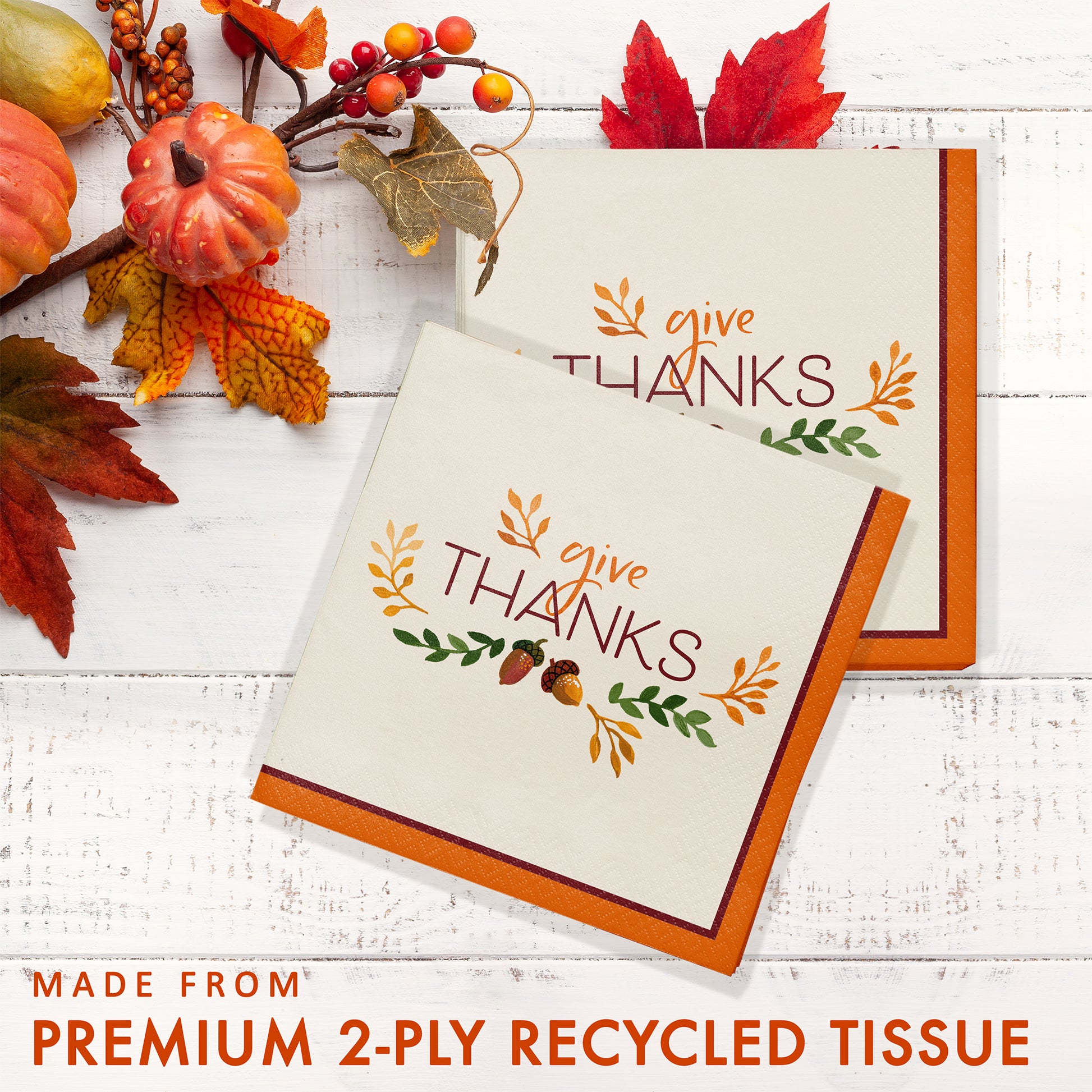 Fall Festivities Give Thanks Thanksgiving Luncheon Napkins 192 ct. Thanksgiving-themed tissue paper with 'give THANKS' text on a white wooden surface with autumn decorations.