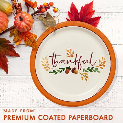 Fall Festivities Thankful Thanksgiving Dessert Paper Plates 96 ct. Decorative paper plate with 'thankful' text and autumn elements on a white wooden surface.