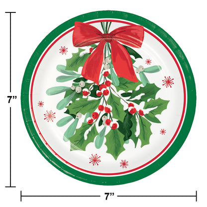 Round paper plate with holly design, red bow, and measurements on a white background