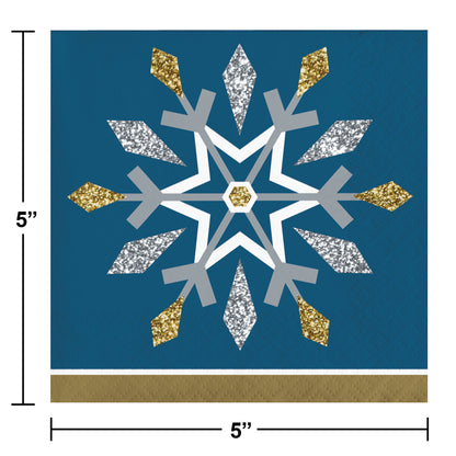 Decorative paper napkin with a snowflake design on a blue background, shown with dimensions.