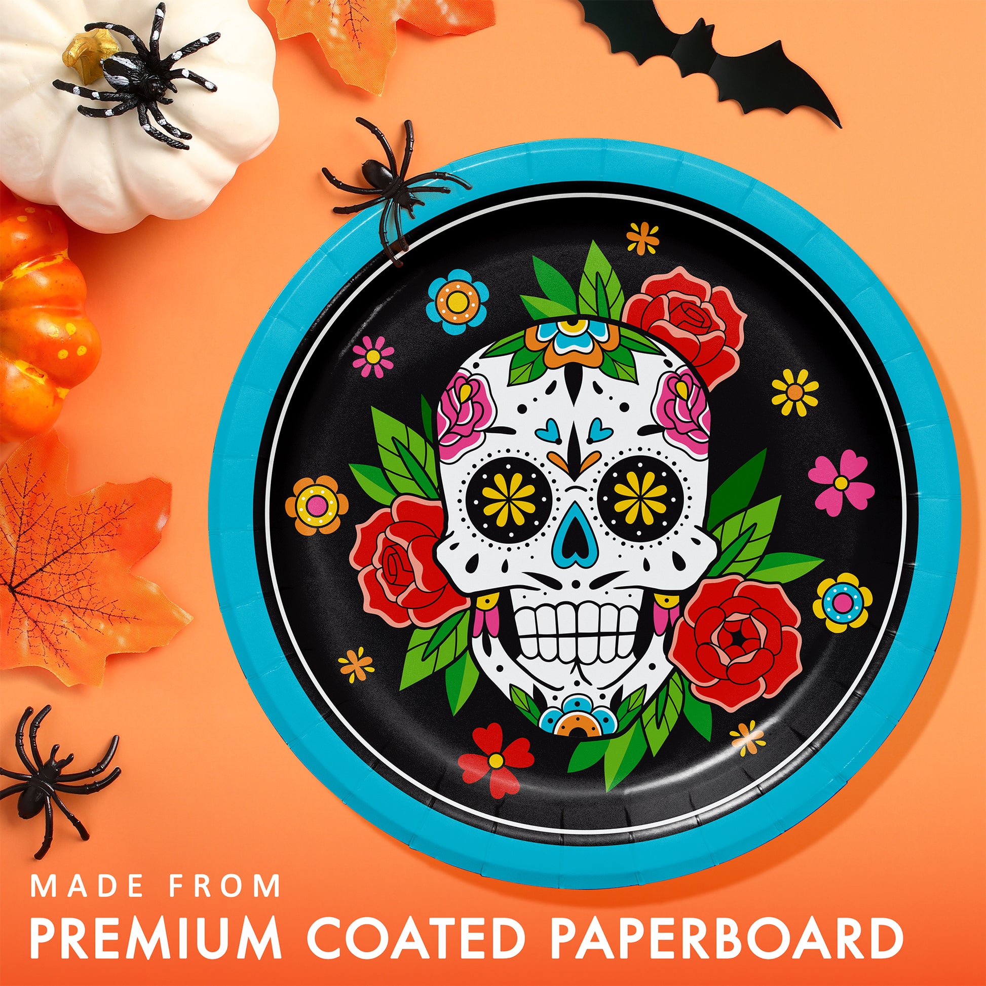 Skelebration Dinner Paper Plates 96 ct. Halloween-themed paper plate with colorful skull design on an orange background with pumpkins and spiders.