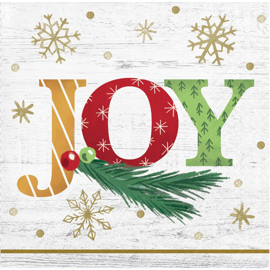 Christmas-themed 'JOY' paper napkin with gold snowflakes and greenery on a white background