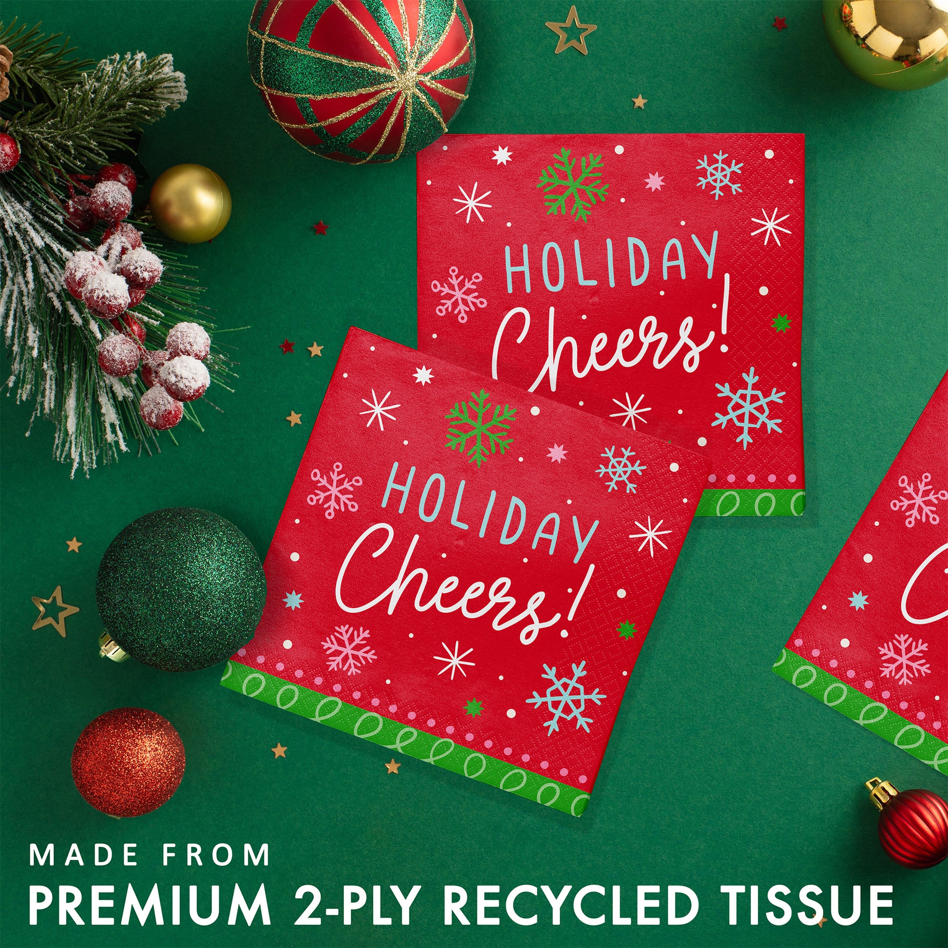 Holiday Frills Holiday Cheers Beverage Napkins 192 ct. Red 'Holiday Cheers!' paper napkins with Christmas decorations on a green background