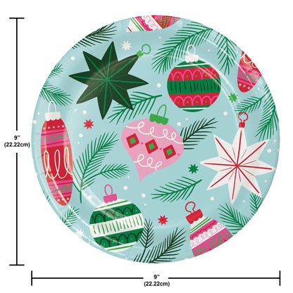 Holiday Frills Dinner Paper Plates 96 ct. Round paper plate with Christmas-themed design featuring ornaments and stars on a blue background, with dimensions indicated.