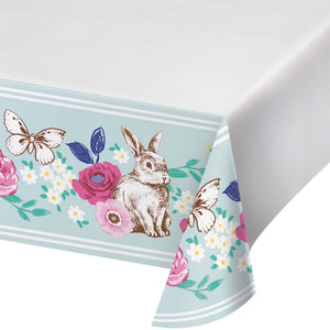 Tablecloth with rabbit, flowers, and butterflies design on a light blue background