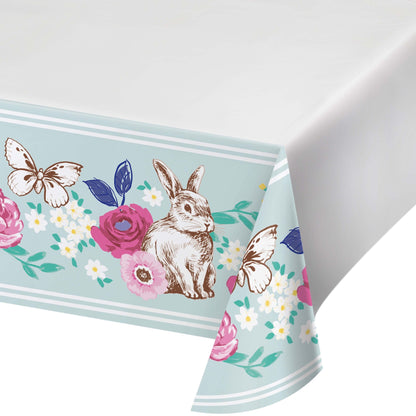 Tablecloth with rabbit, flowers, and butterflies design on a light blue background