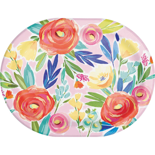 Round plate with colorful floral design on a pink background