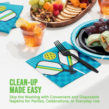 Disposable napkins with a design of two pickleball paddles and ball with a fork on a table setting with food.