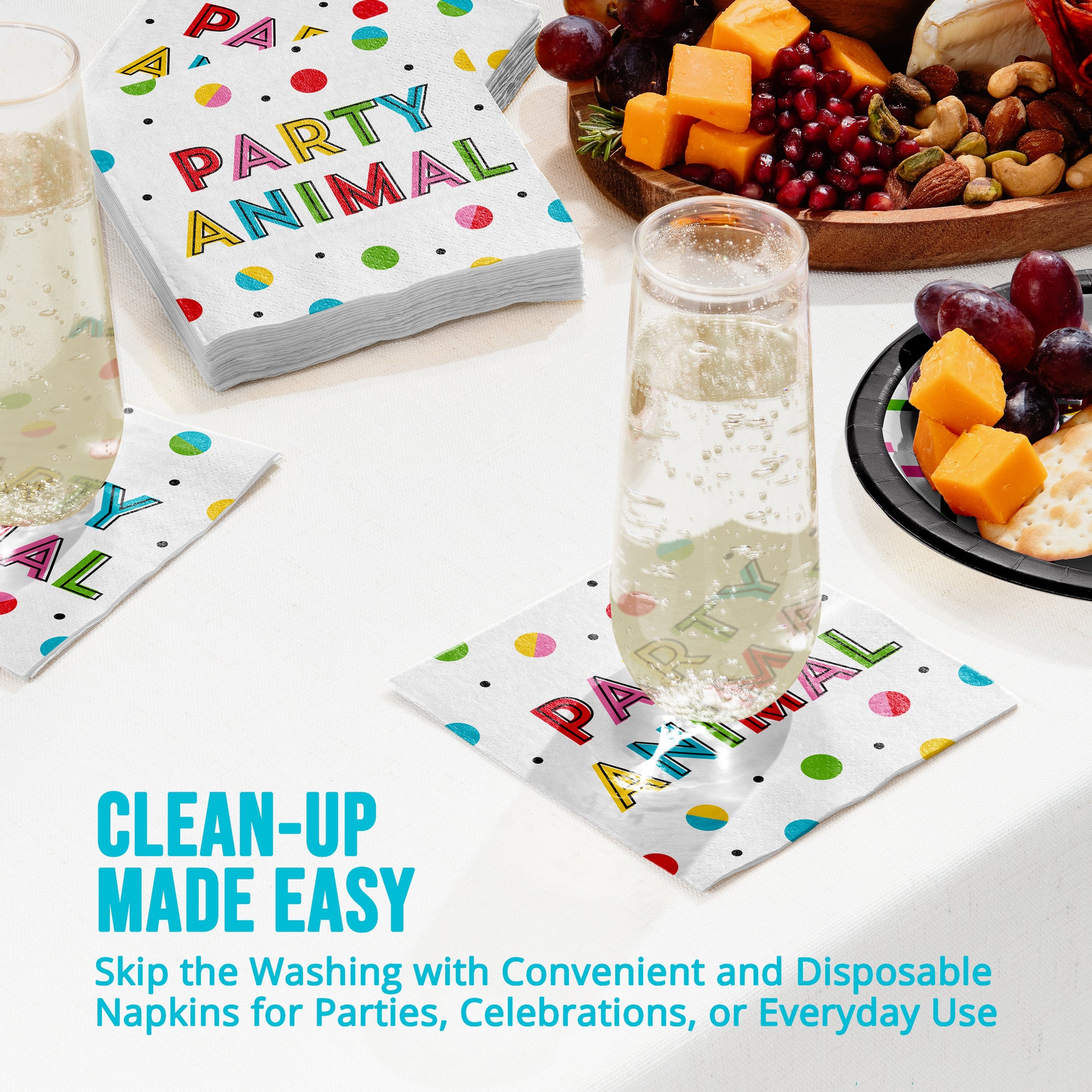 Disposable napkins with colorful text on a table with snacks and drinks.