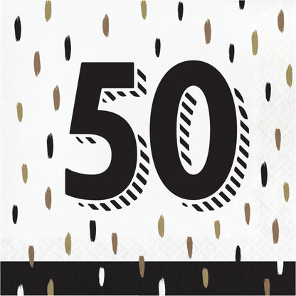 Napkin with black number '50' on a white background with black and gold dots paint brush strokes