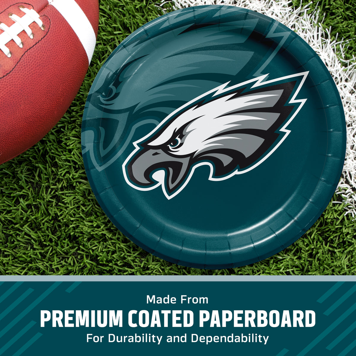Philadelphia Eagles themed paper plate on a green turf background with a football partially visible, featuring a text banner at the bottom that reads 'Made From PREMIUM COATED PAPERBOARD For Durability and Dependability'.