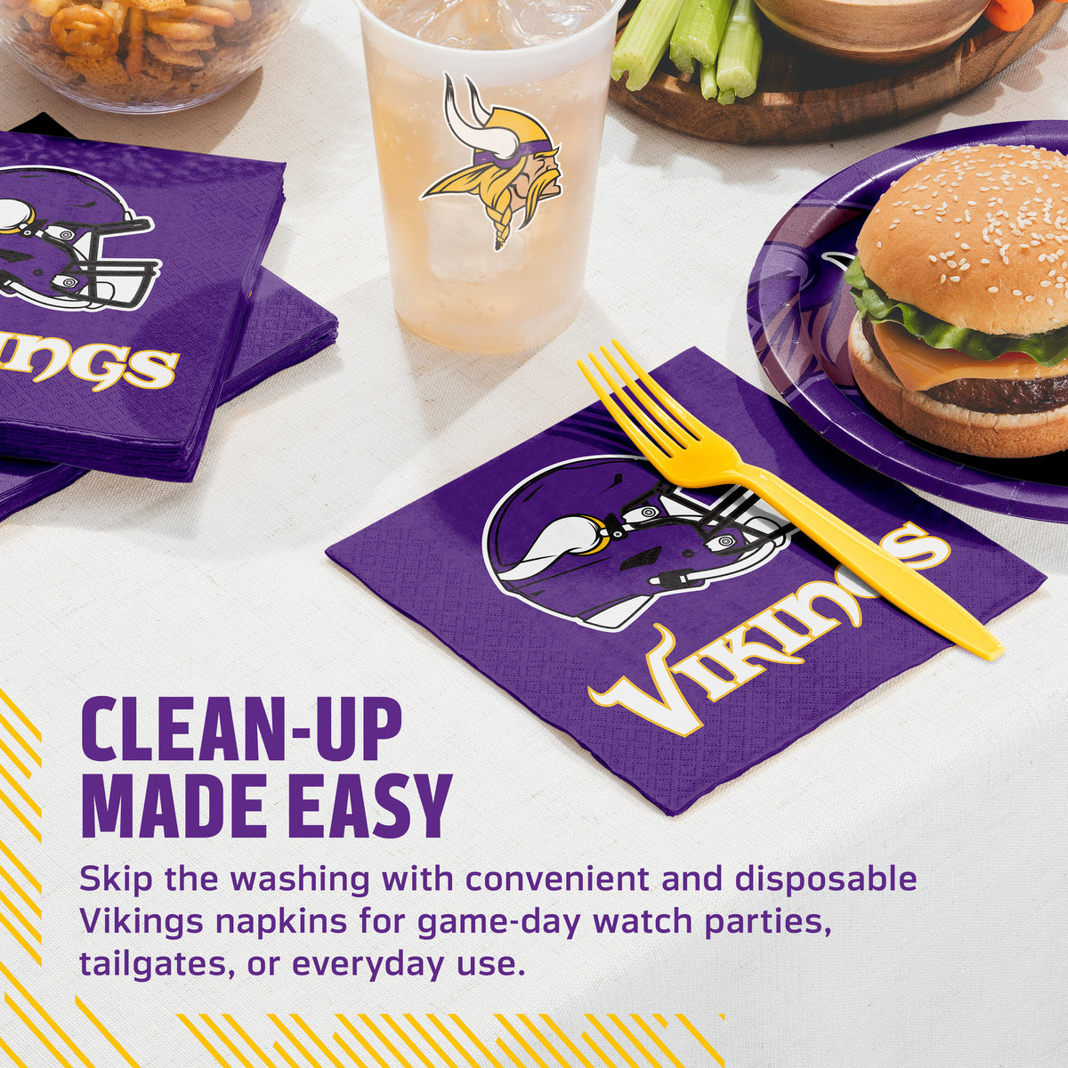 Purple Vikings-themed paper napkins with a white helmet logo and gold lettering, shown on a table with a matching yellow plastic fork, a drink cup, a burger, and promotional text reading 'CLEAN-UP MADE EASY'.