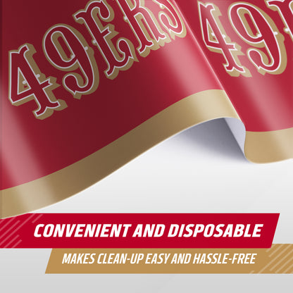 A close-up of a red and gold 49ers-themed disposable tablecloth, showing the team logo and text that reads 'CONVENIENT AND DISPOSABLE' and 'MAKES CLEAN-UP EASY AND HASSLE-FREE'.