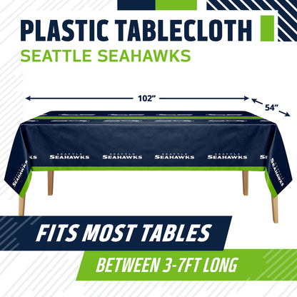 Seattle Seahawks themed plastic tablecloth shown draped over a table, with size arrows indicating 102 by 54 inches. Text at top reads 'PLASTIC TABLECLOTH SEATTLE SEAHAWKS' and bottom banner says 'FITS MOST TABLES BETWEEN 3-7FT LONG'.