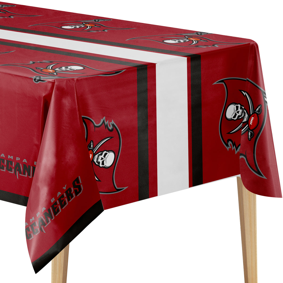 A Tampa Bay Buccaneers themed plastic tablecloth draped over a rectangular table, showing the team logo and name printed across the red fabric with a white  and black center stripe.