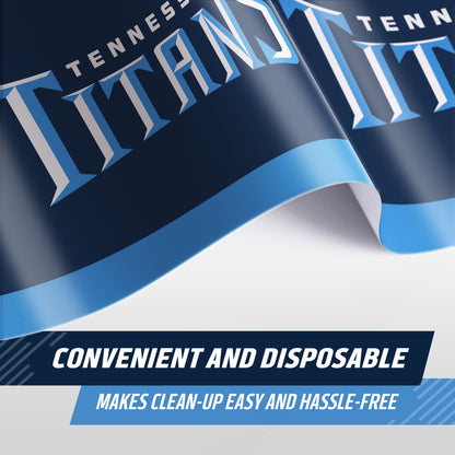 A close-up of a Tennessee Titans branded tablecloth, with the team name in large white and blue lettering on a navy blue background. Text at the bottom reads 'CONVENIENT AND DISPOSABLE' and 'MAKES CLEAN-UP EASY AND HASSLE-FREE'.