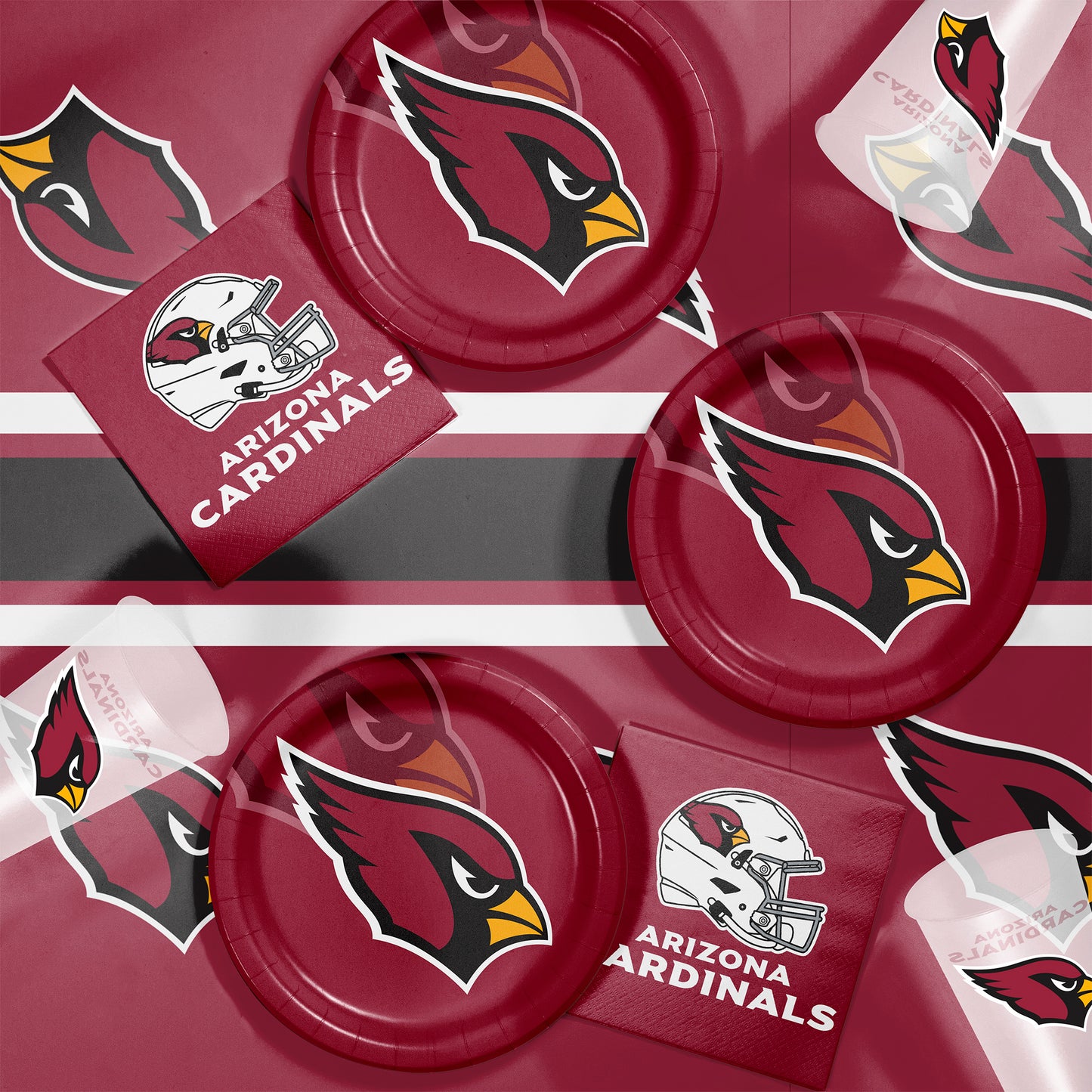 Arizona Cardinals-themed party supplies including plates and napkins on a black background.