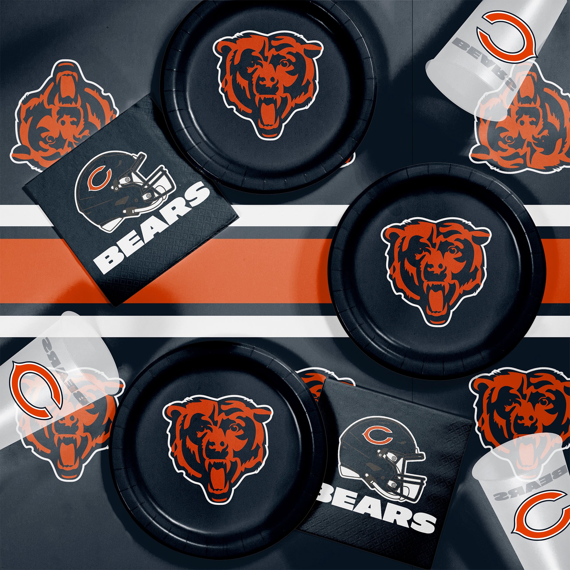 Collection of Chicago Bears-themed items including paper plates, napkins and cups on a dark background.