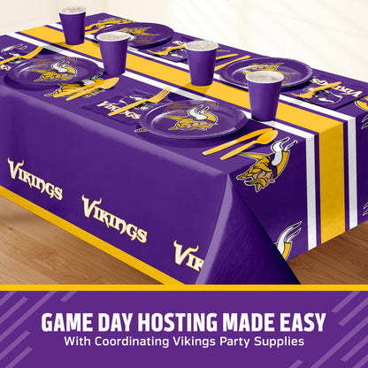 Minnesota Vikings themed party table setting with a printed tablecloth, matching plates, cups, and utensils, shown on a table with a promotional banner at the bottom that says "Game Day Hosting Made Easy".