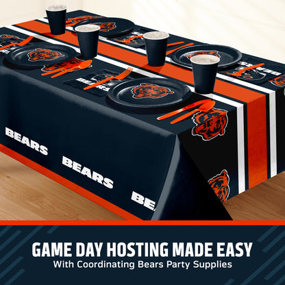 Chicago Bears themed party table setting with a printed tablecloth, matching plates, cups, and utensils, shown on a table with a promotional banner at the bottom that says "Game Day Hosting Made Easy".