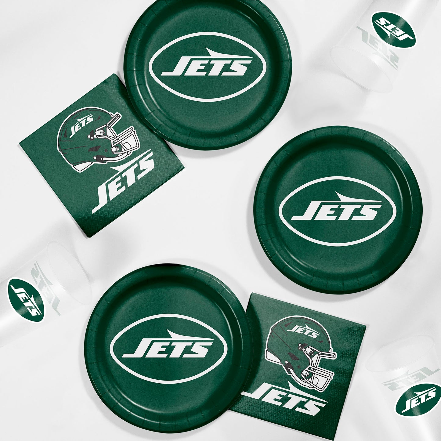 Green 'Jets' branded paper plates and napkins on a white background