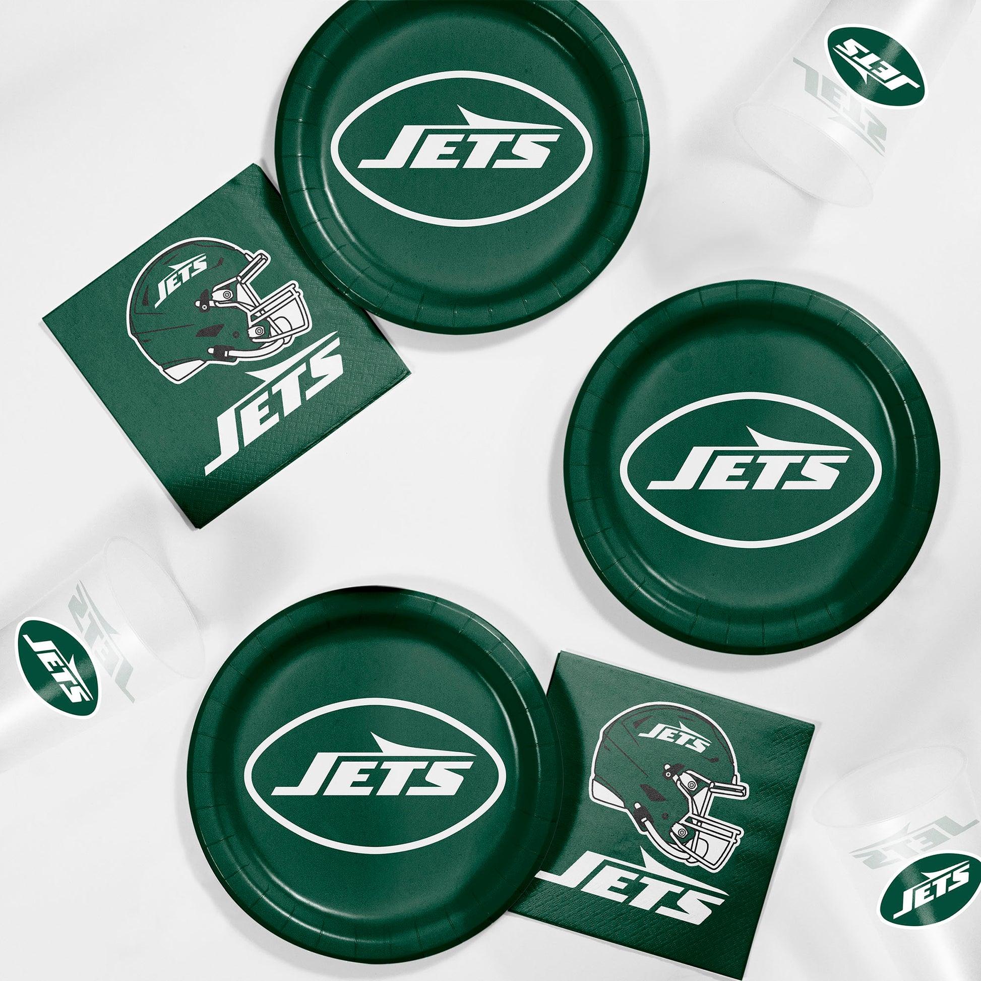Green 'Jets' branded paper plates and napkins on a white background