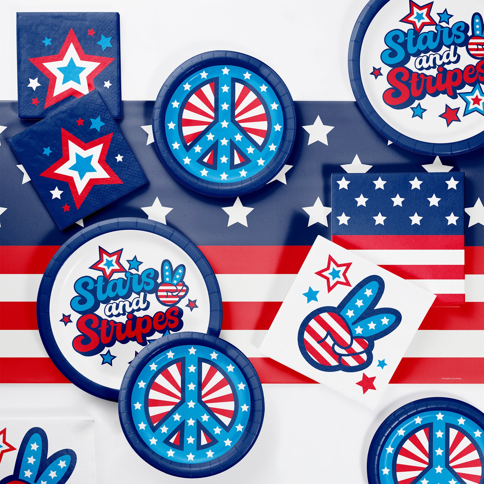 Collection of party supplies with American flag and peace symbol design on an American flag background