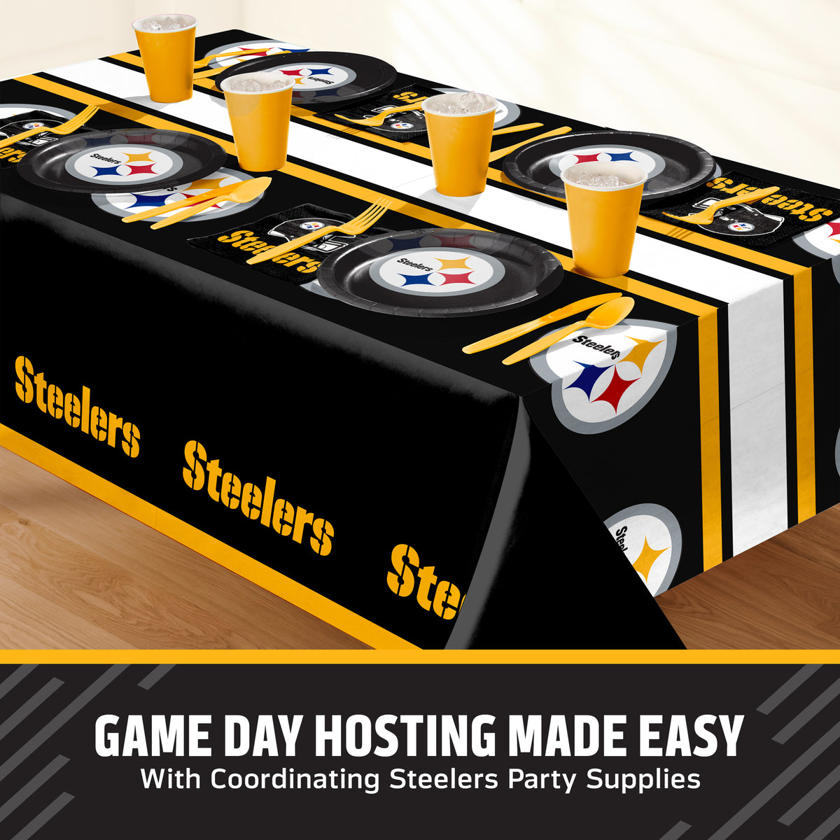 Pittsburgh Steelers themed party table setting with a printed tablecloth, matching plates, cups, and utensils, shown on a table with a promotional banner at the bottom that says "Game Day Hosting Made Easy".