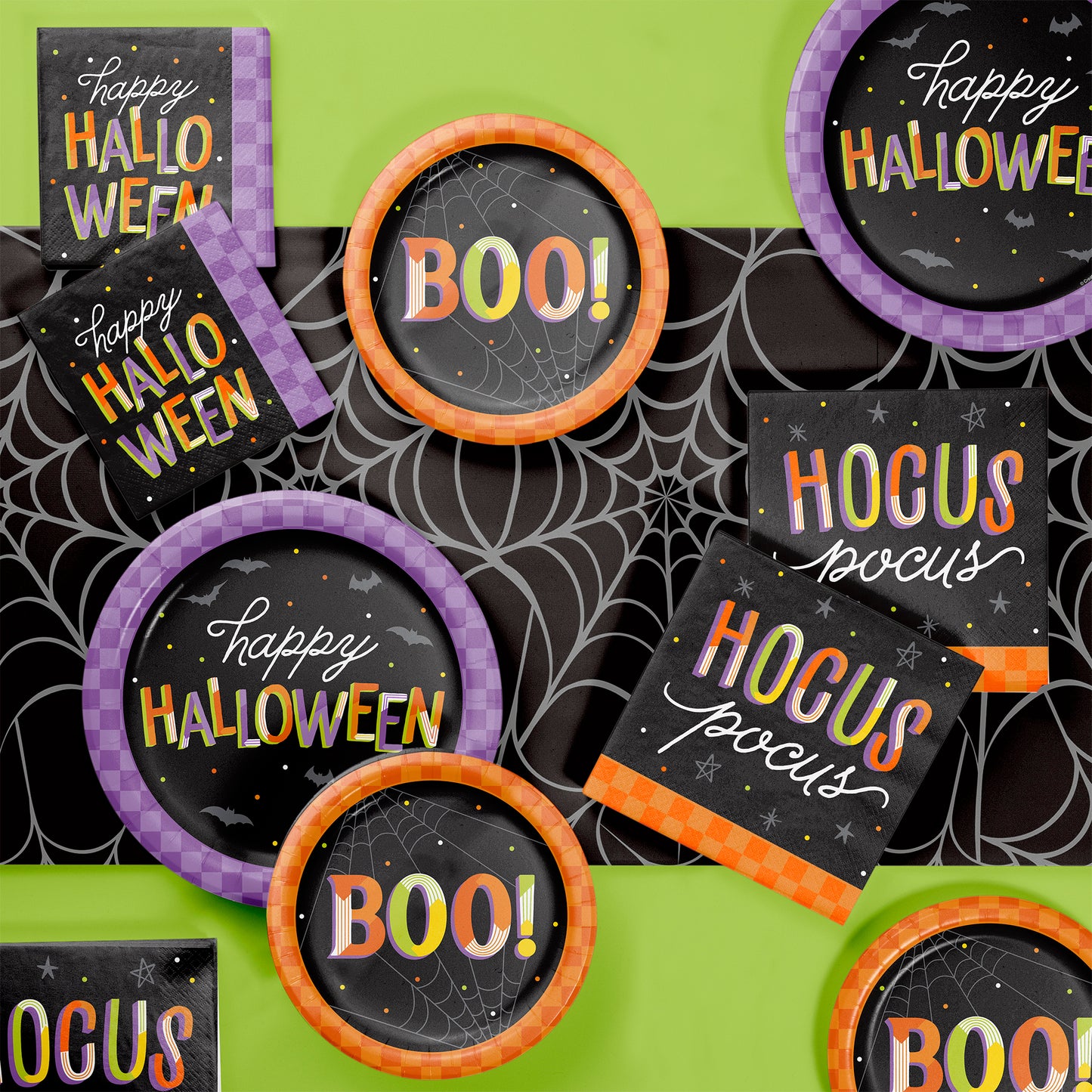 Retro Happy Halloween Dinner Paper Plates 96 ct. Halloween-themed decorations with 'Happy Halloween' and 'BOO!' text on a green background.