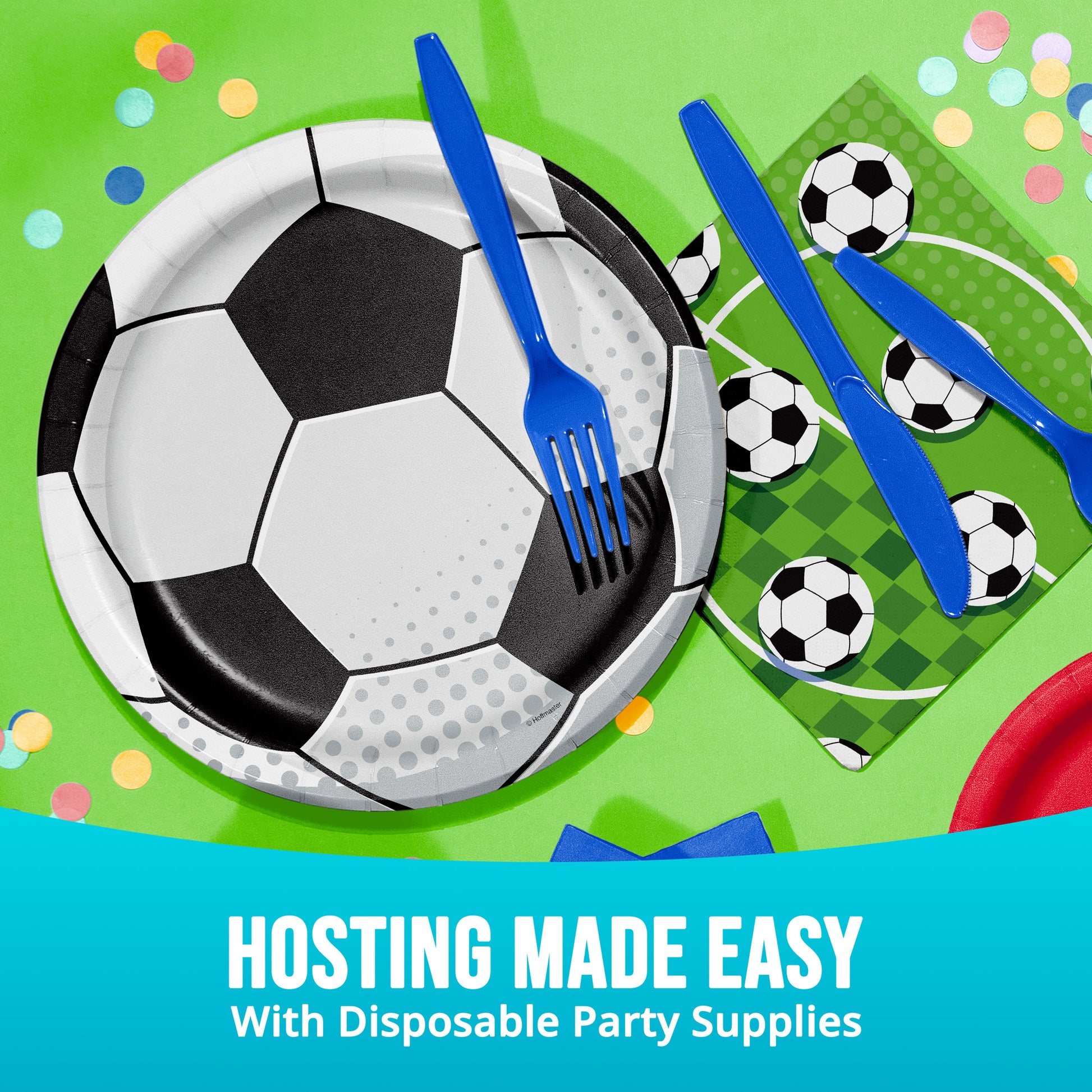 Soccer-themed disposable party supplies including plates, forks, and napkins on a green background with confetti.